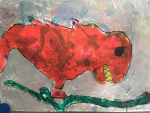 Ein roter gemalter Drache.