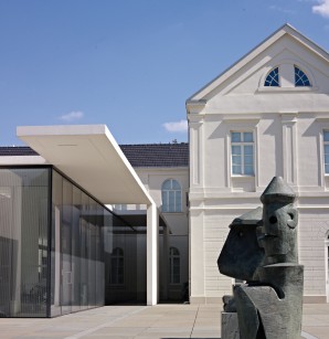 the entrance of the museum with sculptures by Max Ernst.