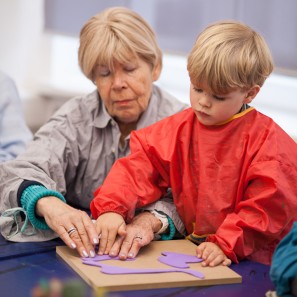 Photo: Grandmother with child while handcrafting